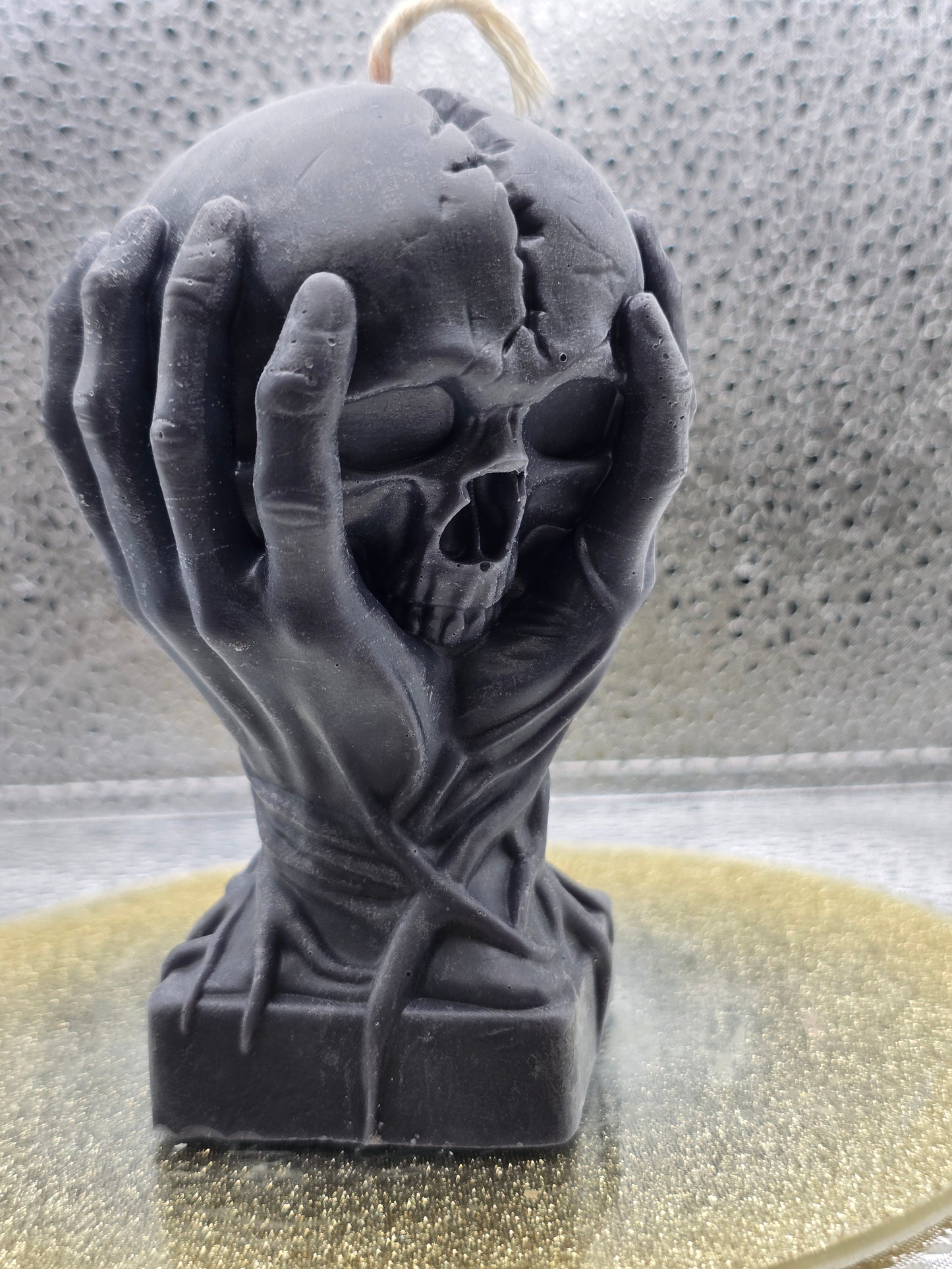 Hands Holding Skull Candle
